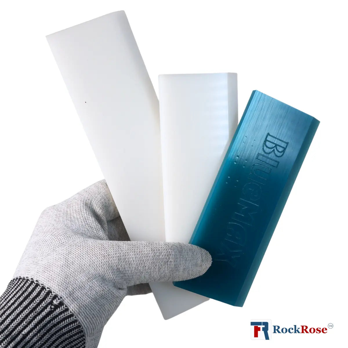 Hand holding a blue bar of plastic blade with branded 'RockRose'.