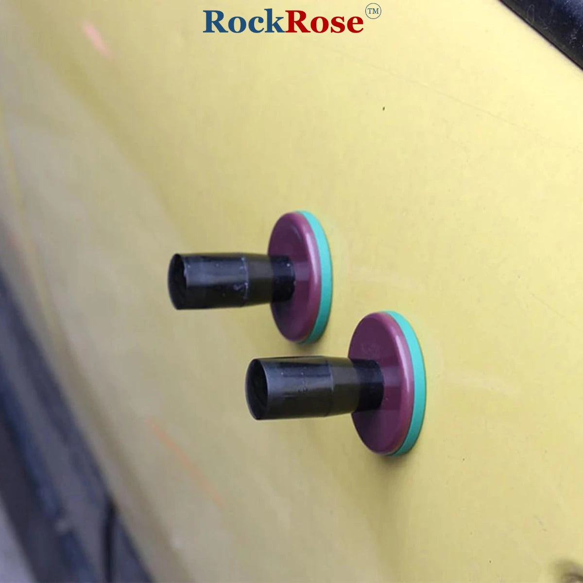 Two black and purple Vinyl Wrap Magnet Tool with teal accents on a yellow background, featuring the RockRose brand.