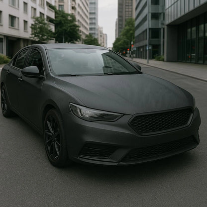 Car fully wrapped with matte 3D carbon fiber vinyl, demonstrating smooth and professional exterior finish.