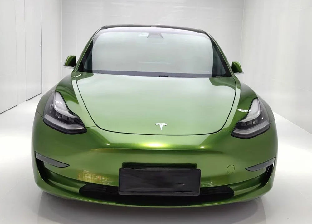 Green Tesla car on a white background