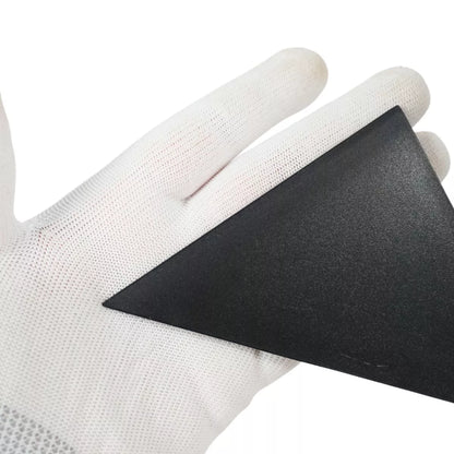 White glove holding a black triangular squeegee on a white background
