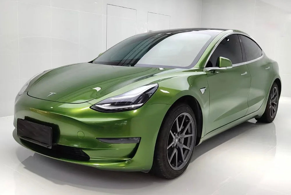 Green Tesla car on a white background
