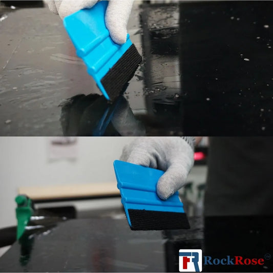 Blue car scrubber being used on a car surface with 'RockRose' branding.