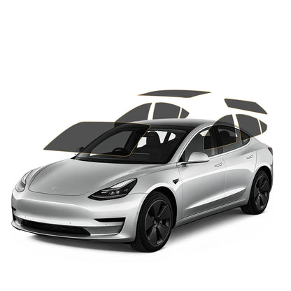 Silver Tesla car with precut tint black roof and wheels on a white background