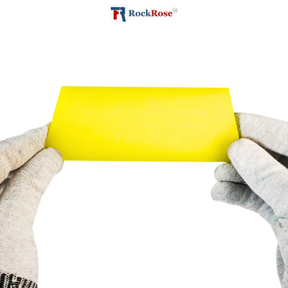 Yellow paint squeegee held by both gloved hands with RockRose logo in the corner