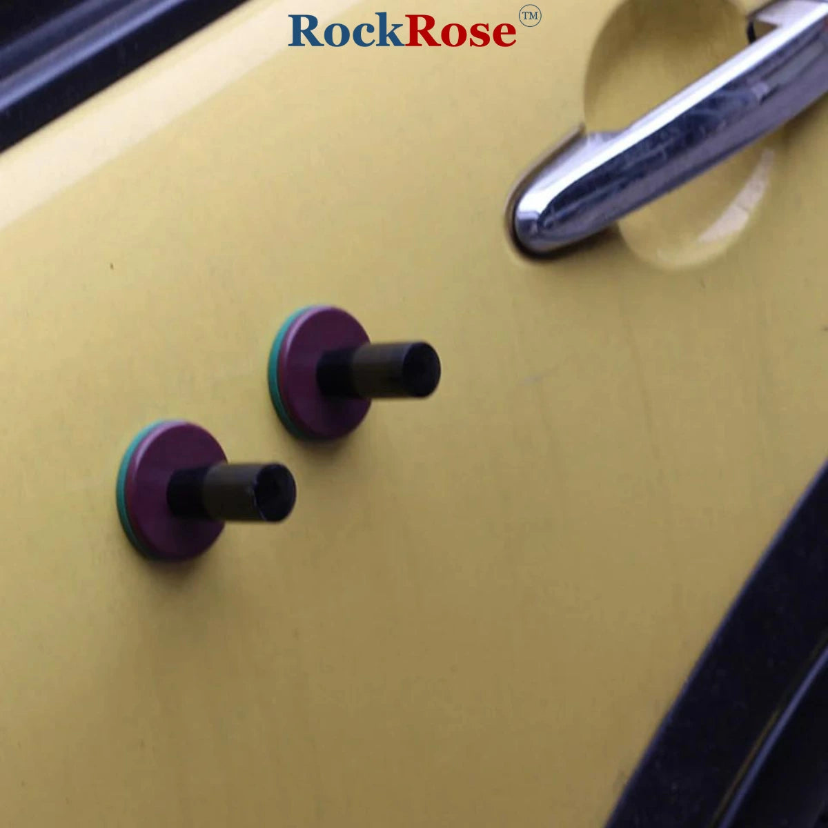 Close-up of a magnet with purple control knobs and 'RockRose' branding.