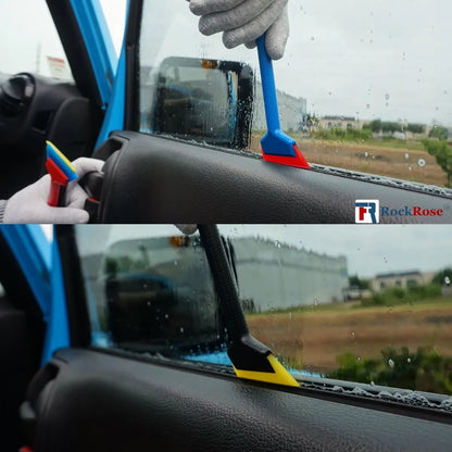 Using a mini squeegee on a car window while holding another set of squeegees