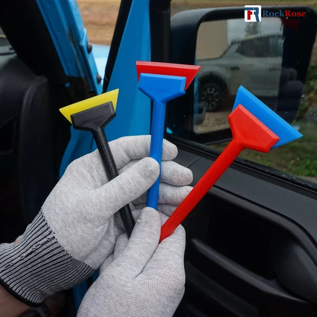 Holding a 3 pcs mini squeegee with white gloves with side mirror on the background