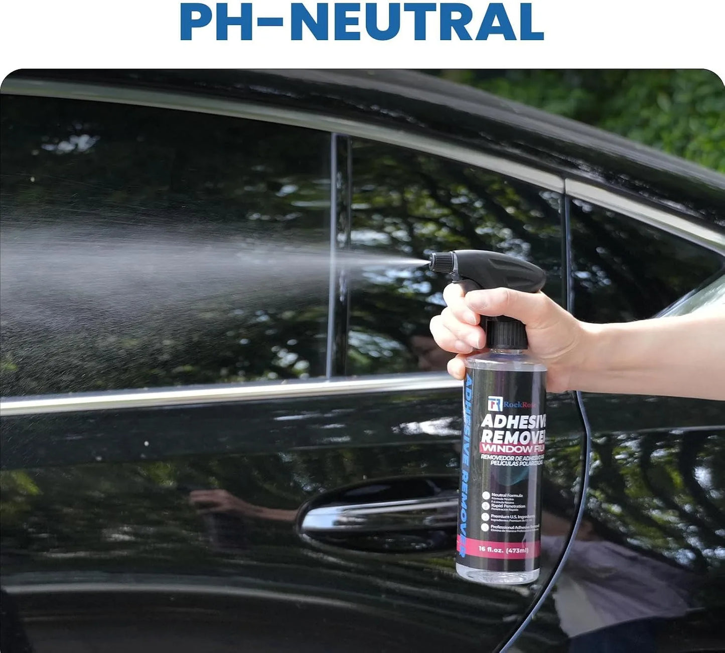 Person using a spray bottle labeled 'Adhesive Remover' on a car window with 'PH-NEUTRAL' text above.