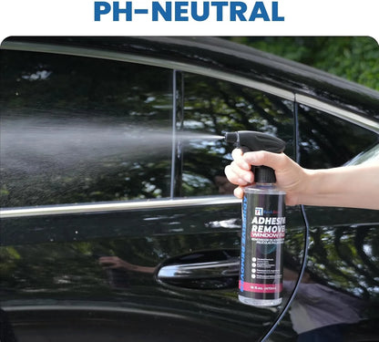 Person using a spray bottle labeled 'Adhesive Remover' on a car window with 'PH-NEUTRAL' text above.
