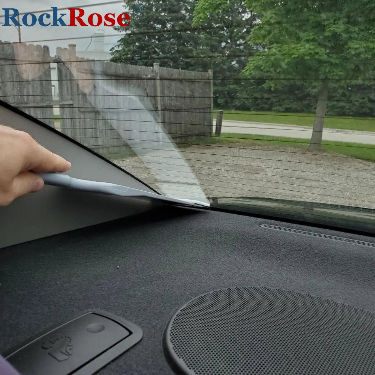 Using a  Long‑Handle Scrubber Squeegee on a car rear winshield