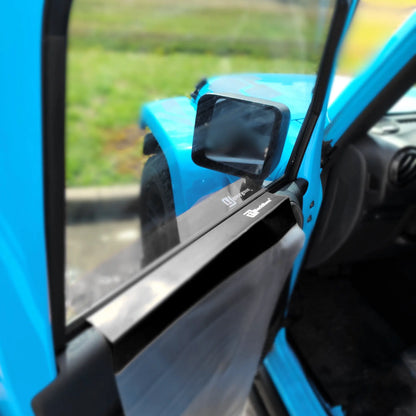 Close-up of a blue vehicle with a black door panel protector attached to side car glass mirror