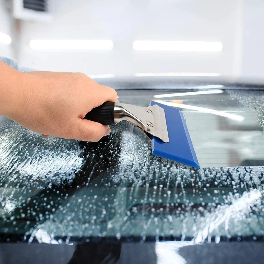 Using a  Pro Rubber Blade Squeegee on a glass surface