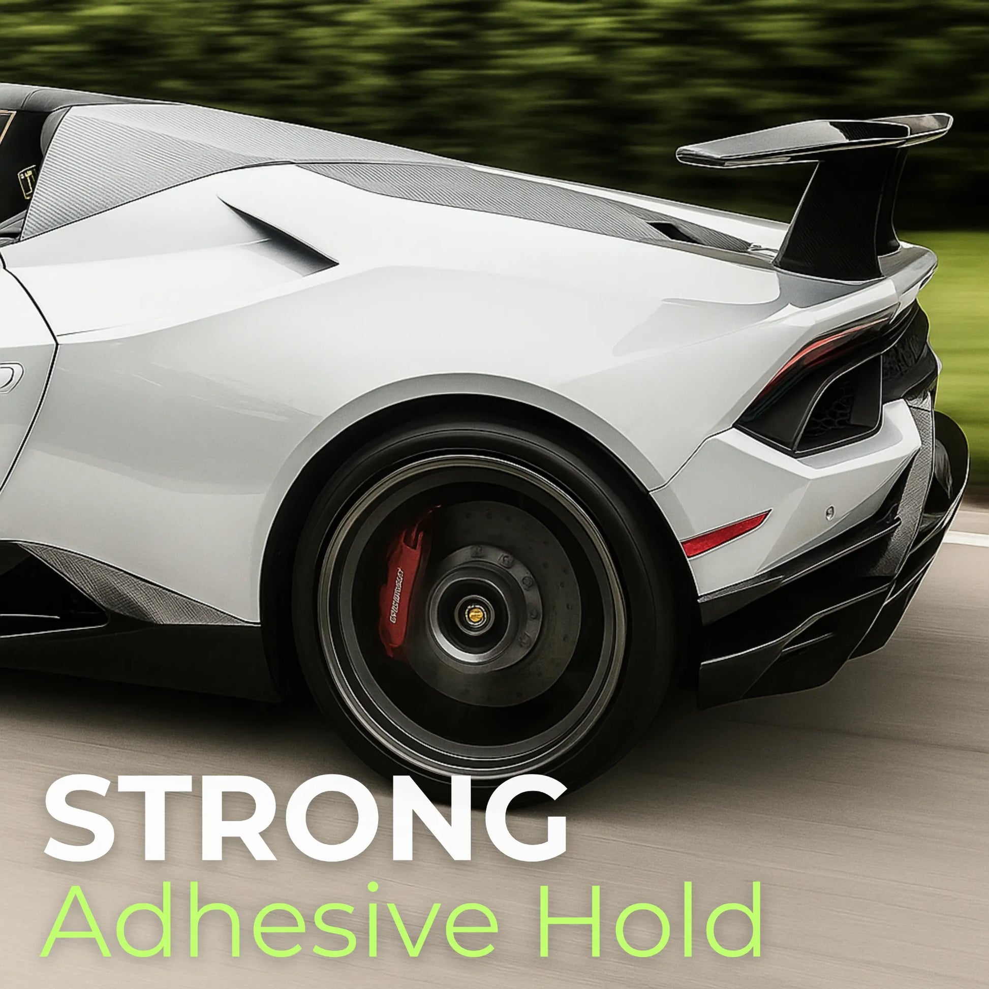 Rear side view of a luxury sports car wrapped in silver 7D carbon fiber vinyl, illustrating the product's strong adhesive hold and seamless integration with complex curves.