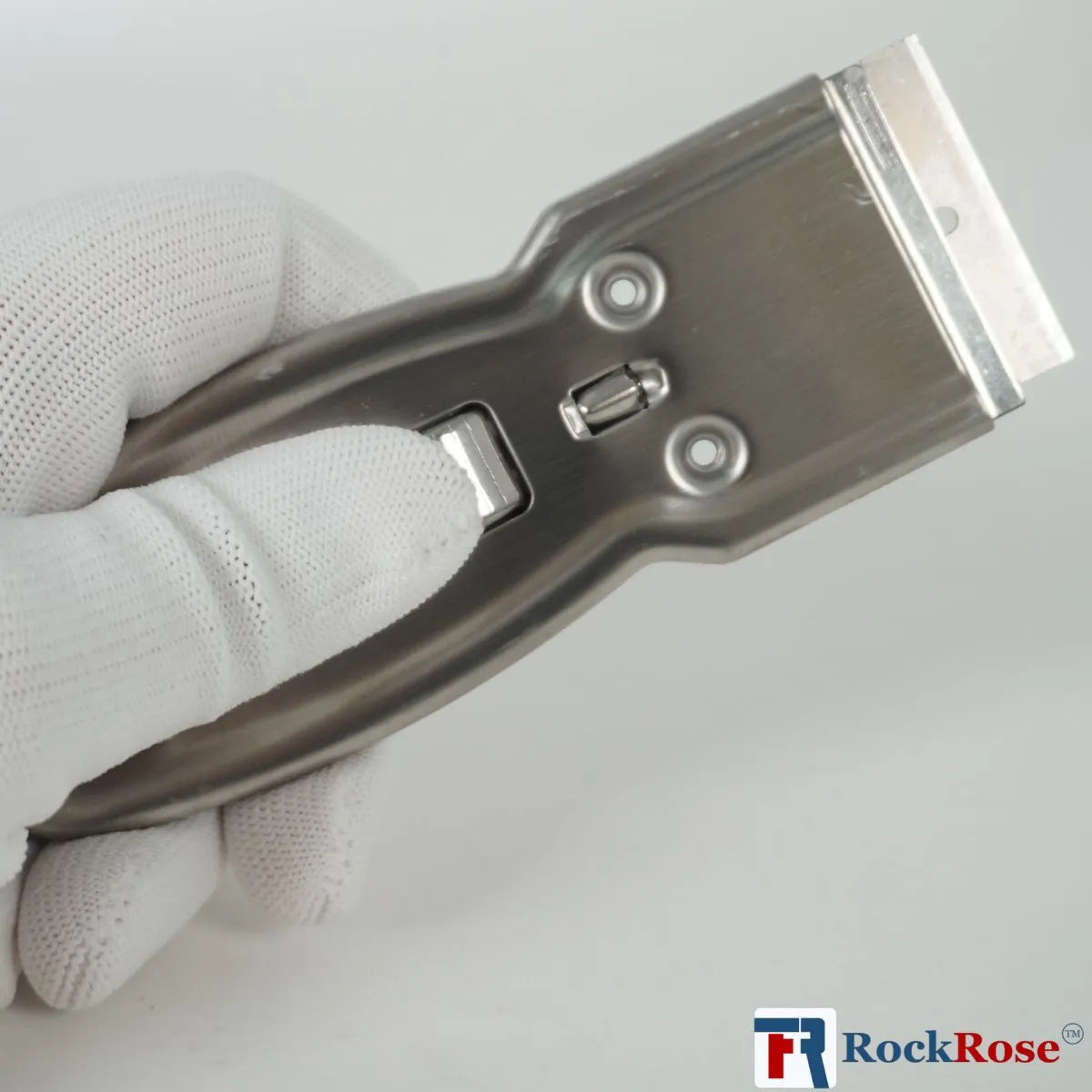 Steel Razor Scraper tool held by a gloved hand on a light gray background, with 'RockRose' branding.