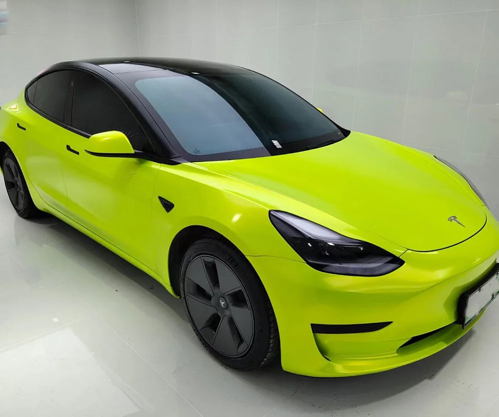 Lime green Tesla car on a white background