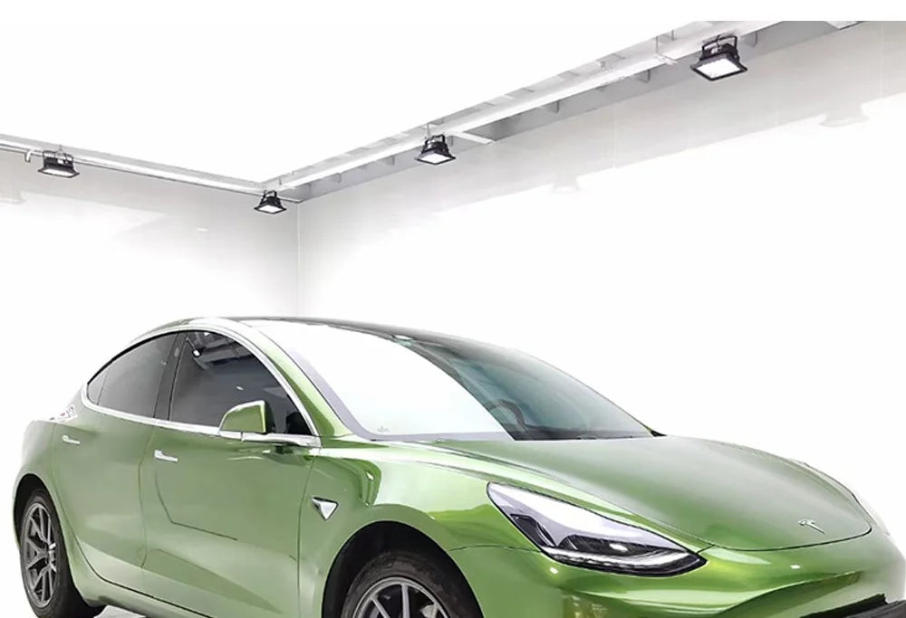 Green electric car on a white background on a rockrosefilm wrap