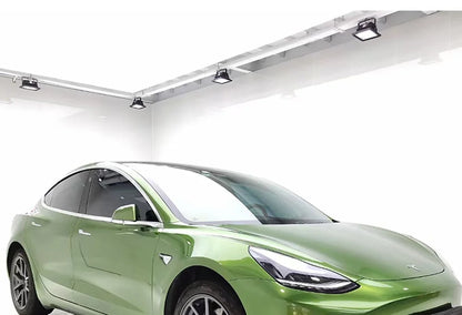 Green electric car on a white background on a rockrosefilm wrap