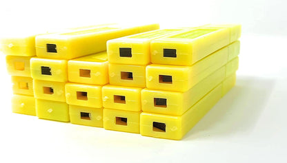 Stack of yellow plastic blocks on a white background