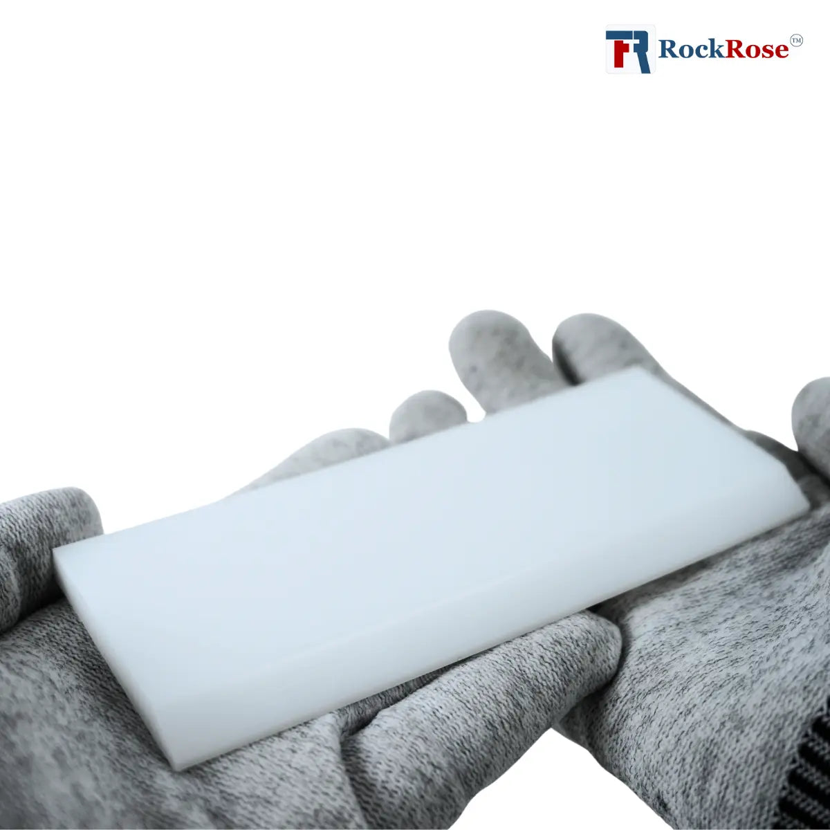 Hand wearing a gray glove holding a white plastic with 'RockRose' branding.