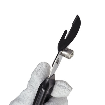 Hand holding a Single blade vinyl cutter  with black handles on a white background