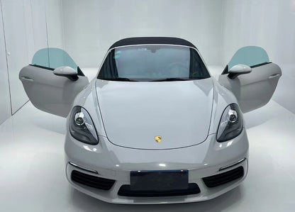 White Porsche car with open doors on a white background