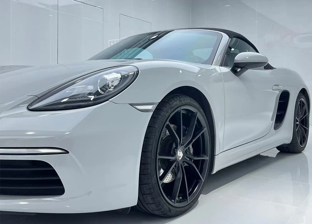 White sports car with black rims on a white background nardo gray